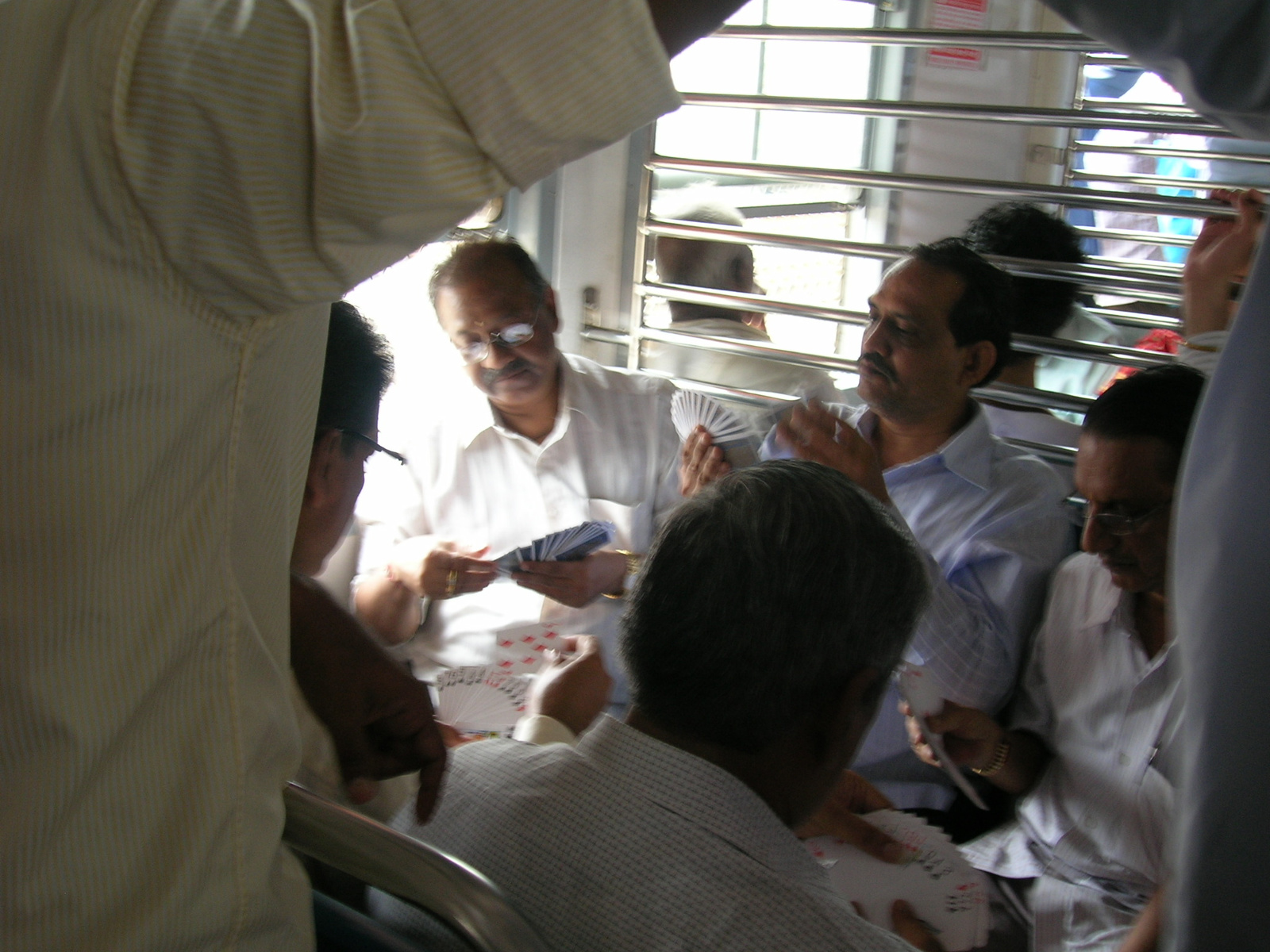 people playing cards on the train