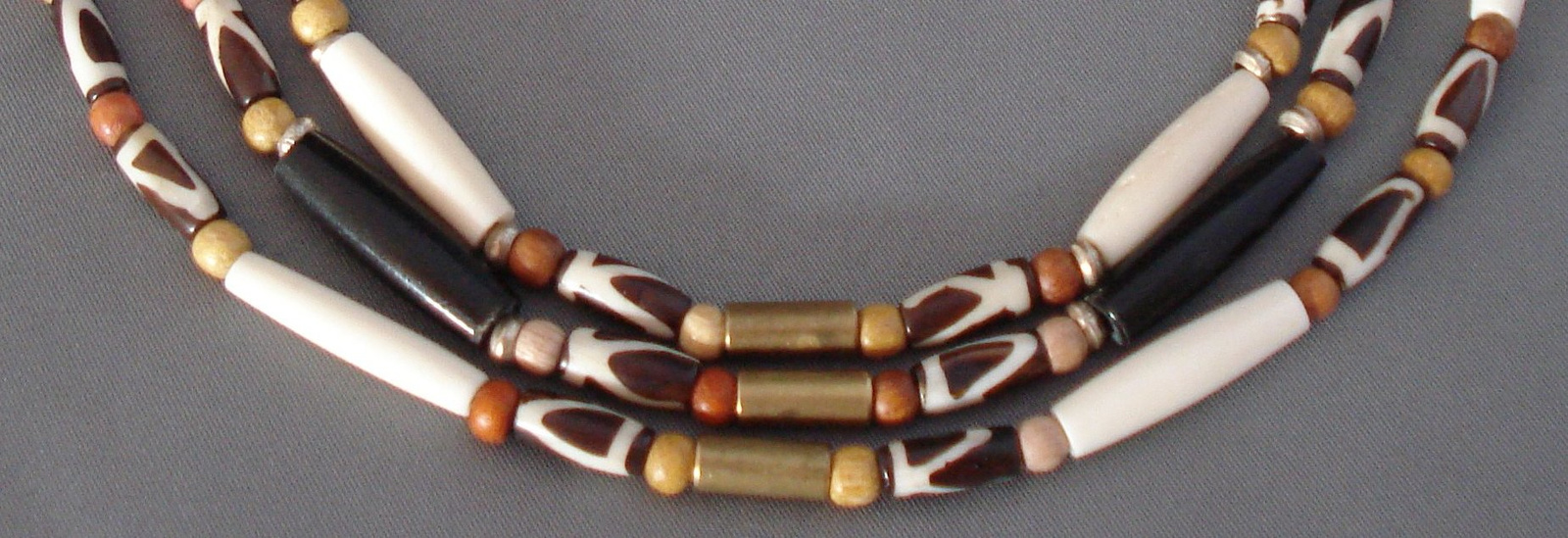 B78 bone  wood and brass 3-strand close up